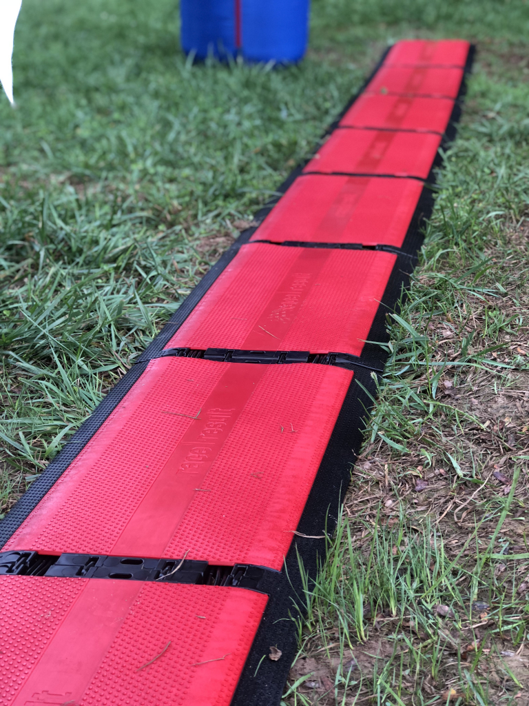 Red race timing mats laid across the course